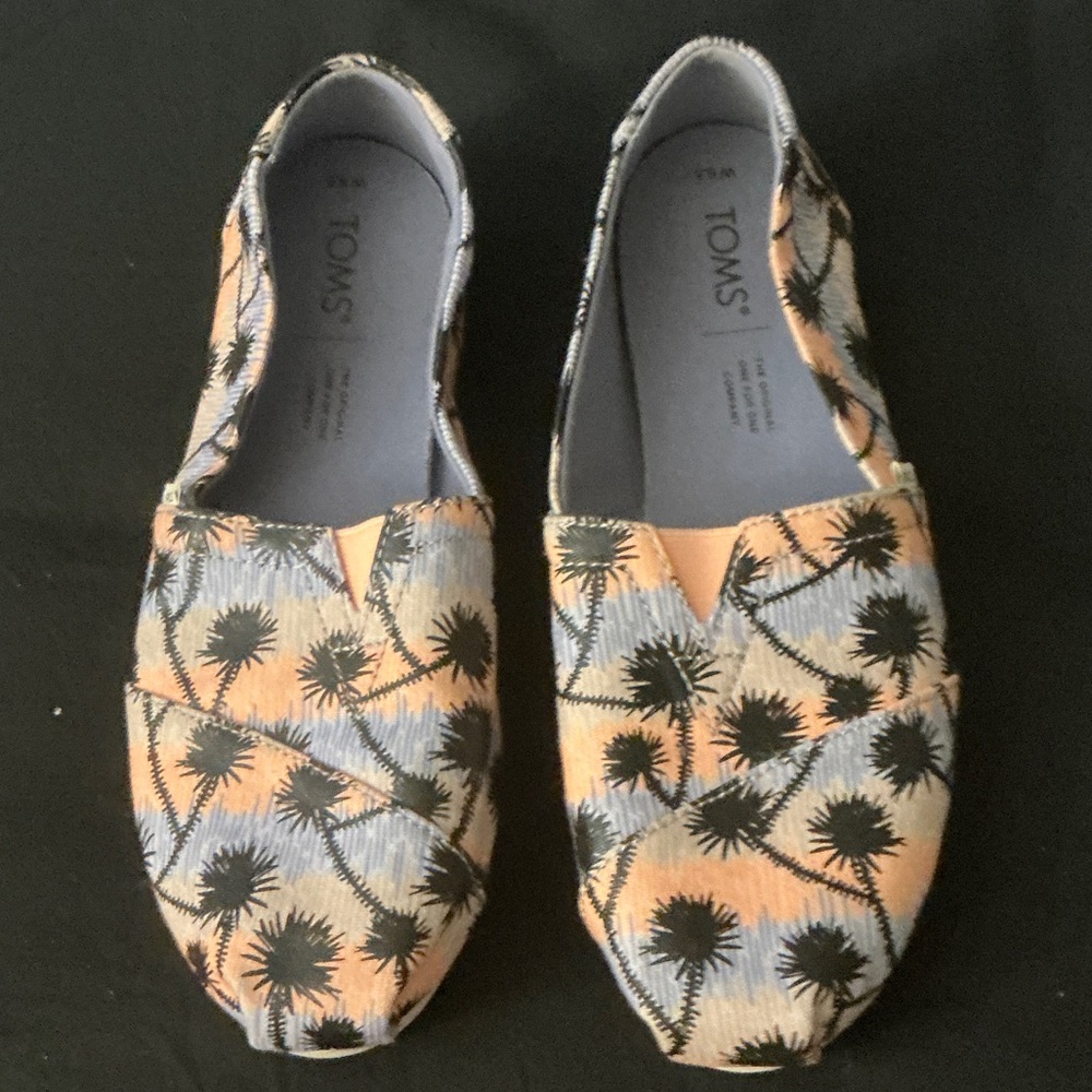TOMS Tropical Patterned Slip-Ons in Orange and Black